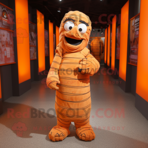 Orange Mummy mascot costume character dressed with a Flannel Shirt and Foot pads