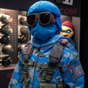 Blue Para Commando mascot costume character dressed with a Jacket and Eyeglasses