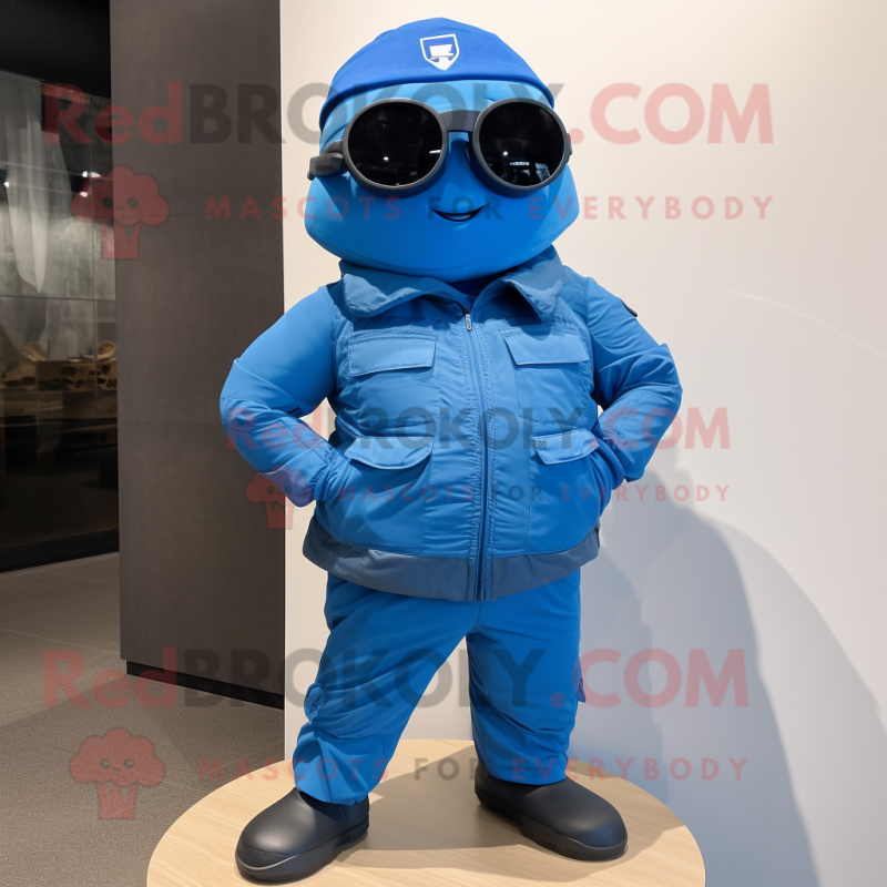 Blue Para Commando mascot costume character dressed with a Jacket and Eyeglasses