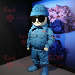 Blue Para Commando mascot costume character dressed with a Jacket and Eyeglasses