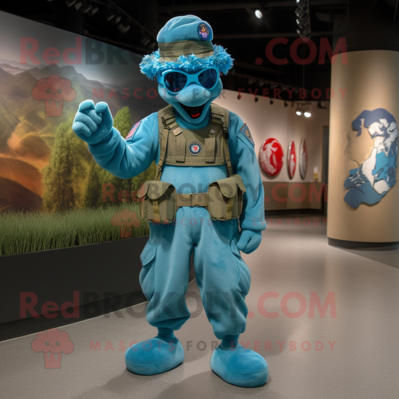 Turquoise American Soldier mascot costume character dressed with a Jumpsuit and Bracelets Turquoise American Soldier mascot costume character dressed with a Jumpsuit and Bracelets