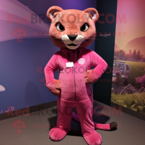 Pink Jaguarundi mascot costume character dressed with a Graphic Tee and Shoe laces