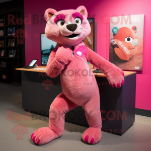 Pink Jaguarundi mascot costume character dressed with a Graphic Tee and Shoe laces