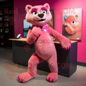 Pink Jaguarundi mascot costume character dressed with a Graphic Tee and Shoe laces