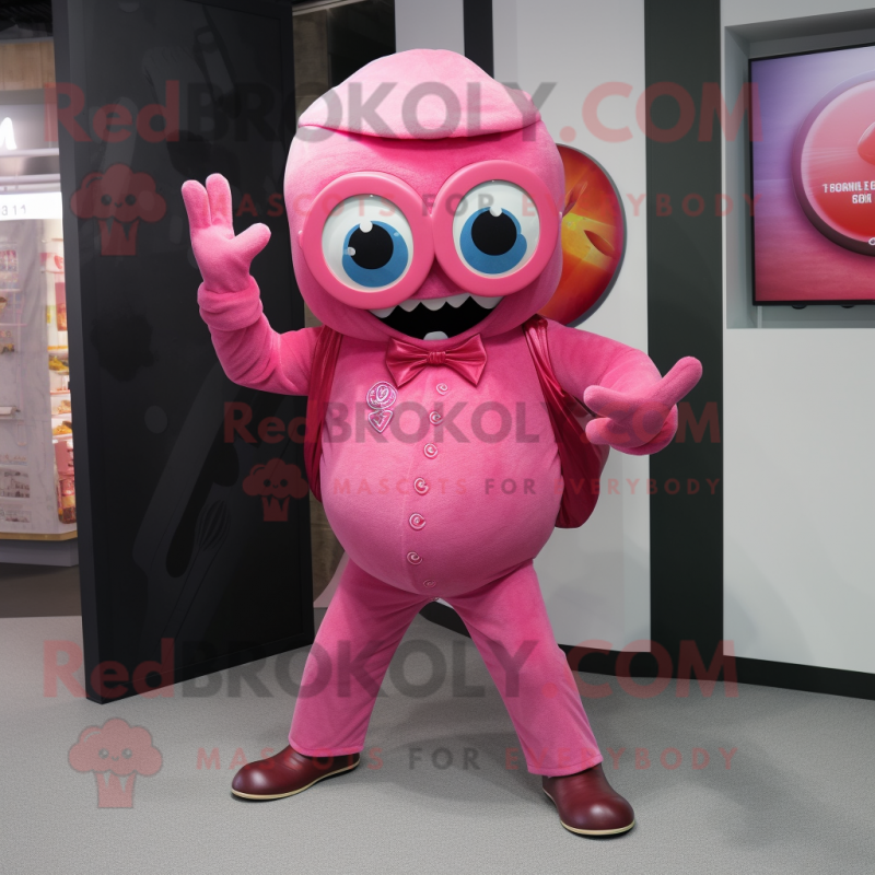 Pink Cyclops mascot costume character dressed with a Flare Jeans and Cufflinks Pink Cyclops mascot costume character dressed with a Flare Jeans and Cufflinks