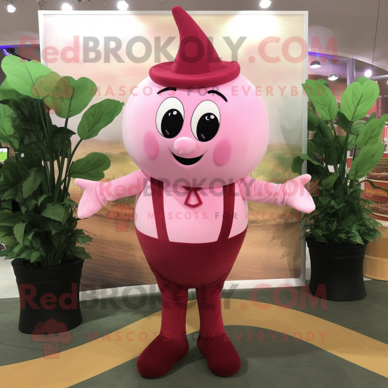 Pink Spinach mascot costume character dressed with a Dress Pants and Suspenders