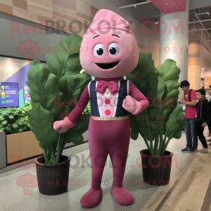 Pink Spinach mascot costume character dressed with a Dress Pants and Suspenders