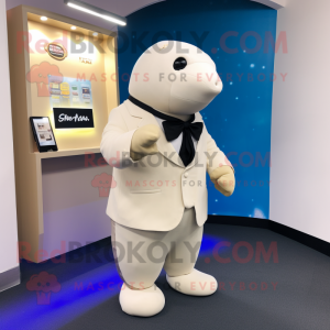 Beige Stellar'S Sea Cow mascot costume character dressed with a Tuxedo and Smartwatches