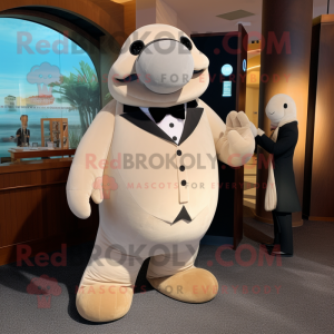 Beige Stellar'S Sea Cow mascot costume character dressed with a Tuxedo and Smartwatches
