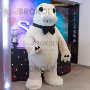 Beige Stellar'S Sea Cow mascot costume character dressed with a Tuxedo and Smartwatches