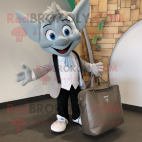 Gray Tooth Fairy mascot costume character dressed with a Blazer and Tote bags