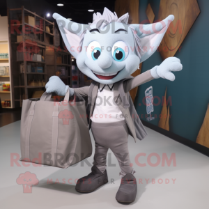 Gray Tooth Fairy mascot costume character dressed with a Blazer and Tote bags