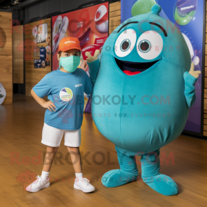 Teal Shakshuka mascot costume character dressed with a Bermuda Shorts and Watches