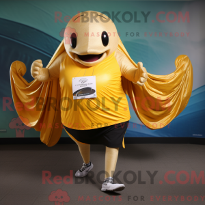Guld pukkelhval maskot...