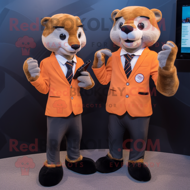 Peach Mongoose mascot costume character dressed with a Suit Jacket and Smartwatches Peach Mongoose mascot costume character dressed with a Suit Jacket and Smartwatches