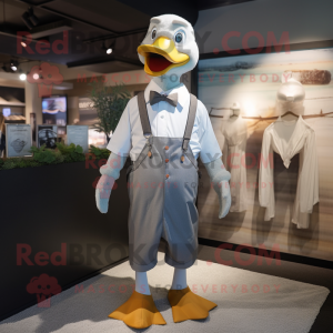 Gray Goose mascot costume character dressed with a Dress Shirt and Suspenders