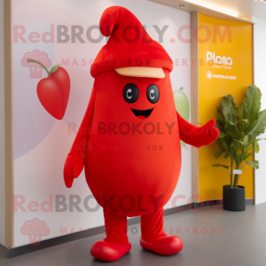 Red Mango mascot costume character dressed with a Trousers and Beanies