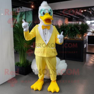 Lemon Yellow Swan mascot costume character dressed with a Suit Pants and Gloves
