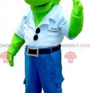 Mascota dinosaurio verde en jeans con una camisa azul -