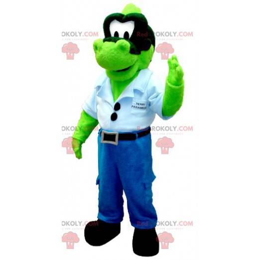 Green dinosaur mascot in jeans with a blue shirt -