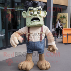 Tan Frankenstein'S Monster mascot costume character dressed with a Denim Shorts and Mittens