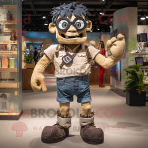 Tan Frankenstein'S Monster mascot costume character dressed with a Denim Shorts and Mittens