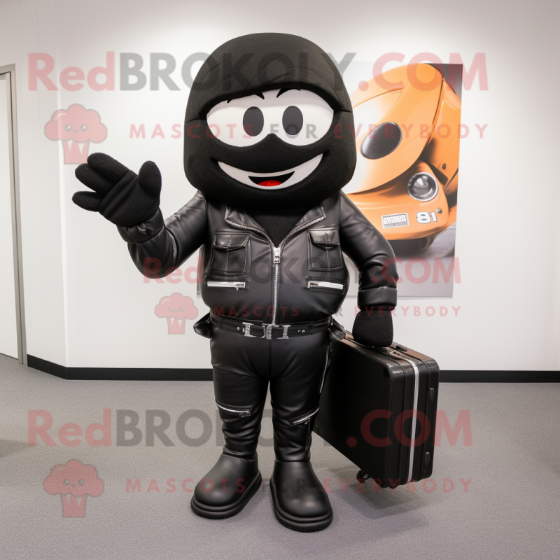 Black Moussaka mascot costume character dressed with a Moto Jacket and Briefcases Black Moussaka mascot costume character dressed with a Moto Jacket and Briefcases