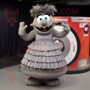 Gray Moussaka mascot costume character dressed with a Pleated Skirt and Rings