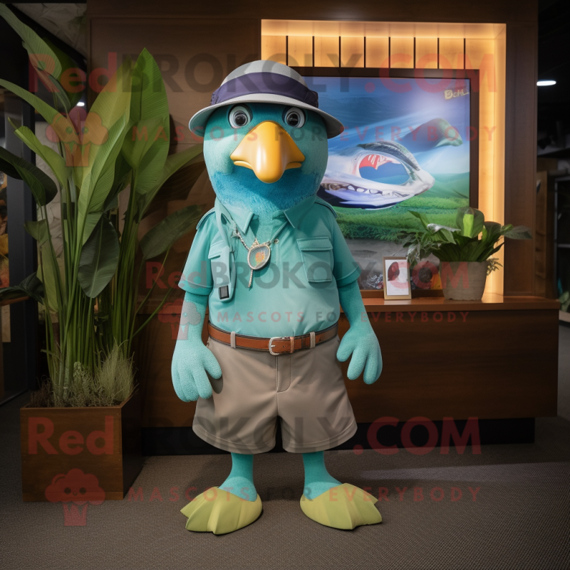 Cyan Kiwi mascot costume character dressed with a Bermuda Shorts and Belts