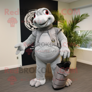 Silver Turtle mascot costume character dressed with a Suit and Backpacks