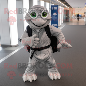 Silver Turtle mascot costume character dressed with a Suit and Backpacks