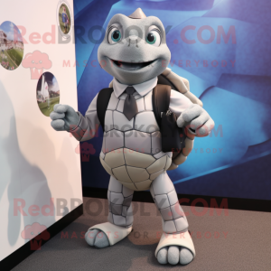 Silver Turtle mascot costume character dressed with a Suit and Backpacks