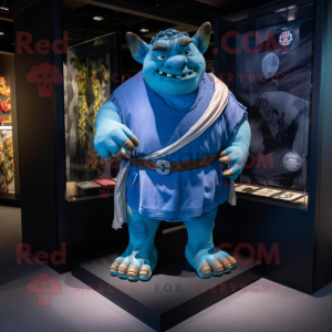 Blue Ogre mascot costume character dressed with a T-Shirt and Shawl pins