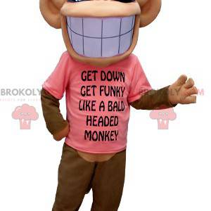 Mascotte de singe marron et beige avec un large sourire -