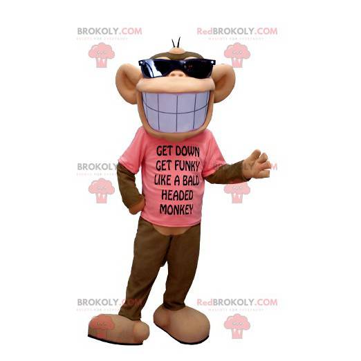 Mascotte de singe marron et beige avec un large sourire -