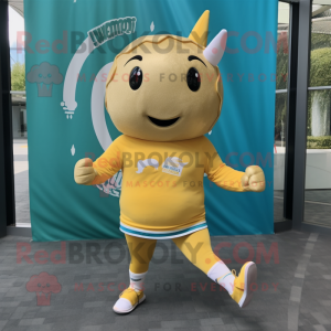Gold Narwhal mascot costume character dressed with a Running Shorts and Headbands