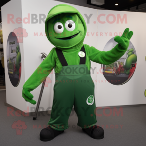 Green Knife Thrower mascot costume character dressed with a Dungarees and Rings