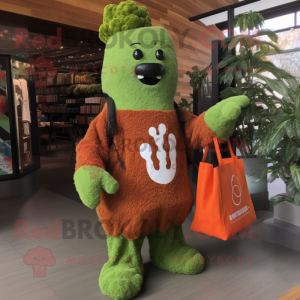 Rust Broccoli mascot costume character dressed with a Long Sleeve Tee and Tote bags