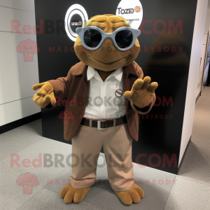Brown Turtle mascot costume character dressed with a Dress Shirt and Rings