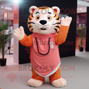 Peach Tiger mascot costume character dressed with a Trousers and Shawl pins