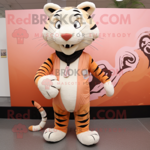 Peach Tiger mascot costume character dressed with a Trousers and Shawl pins