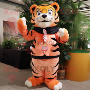 Peach Tiger mascot costume character dressed with a Trousers and Shawl pins