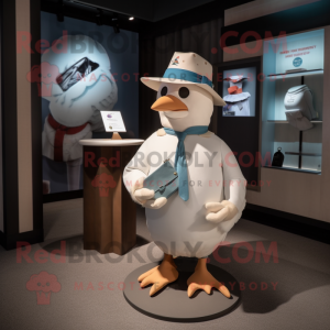 Cream Pigeon mascot costume character dressed with a Graphic Tee and Hats