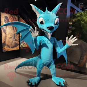 Cyan Pterodactyl mascot costume character dressed with a Graphic Tee and Gloves