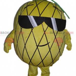 Mascota de piña amarilla y verde con gafas de sol -