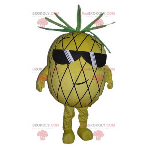 Gelbes und grünes Ananasmaskottchen mit Sonnenbrille -