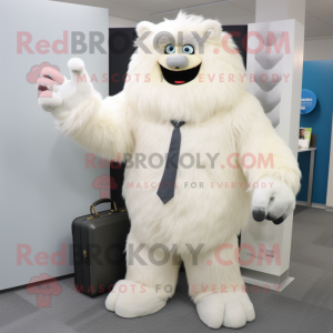 Cream Yeti mascot costume character dressed with a Suit Pants and Handbags