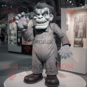 Gray Frankenstein'S Monster mascot costume character dressed with a Suit and Gloves