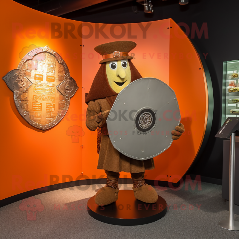 Rust Celtic Shield mascot costume character dressed with a Playsuit and Hat pins Rust Celtic Shield mascot costume character dressed with a Playsuit and Hat pins