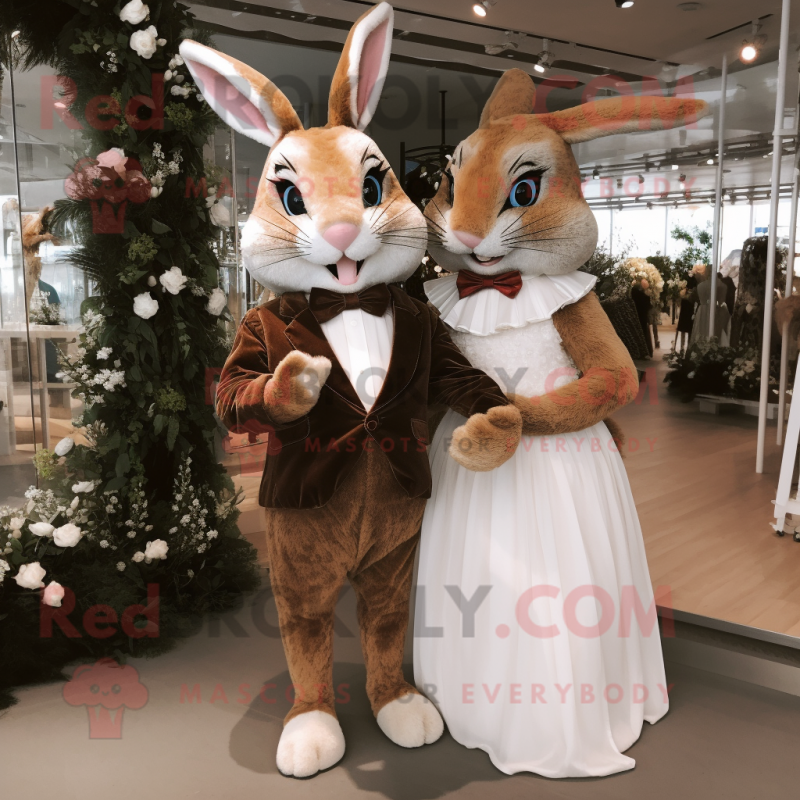 Brown Wild Rabbit mascot costume character dressed with a Wedding Dress and Bow ties